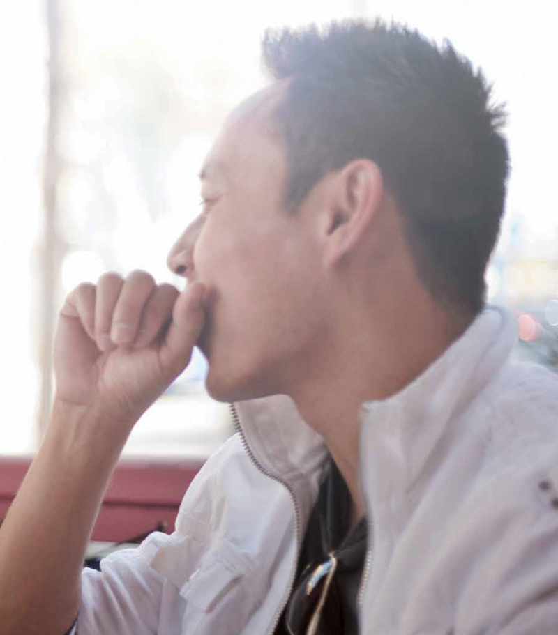Couple eating enjoying a snack at sidewalk cafe