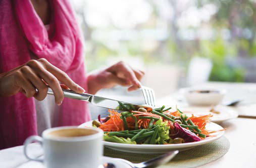 Woman eating salad