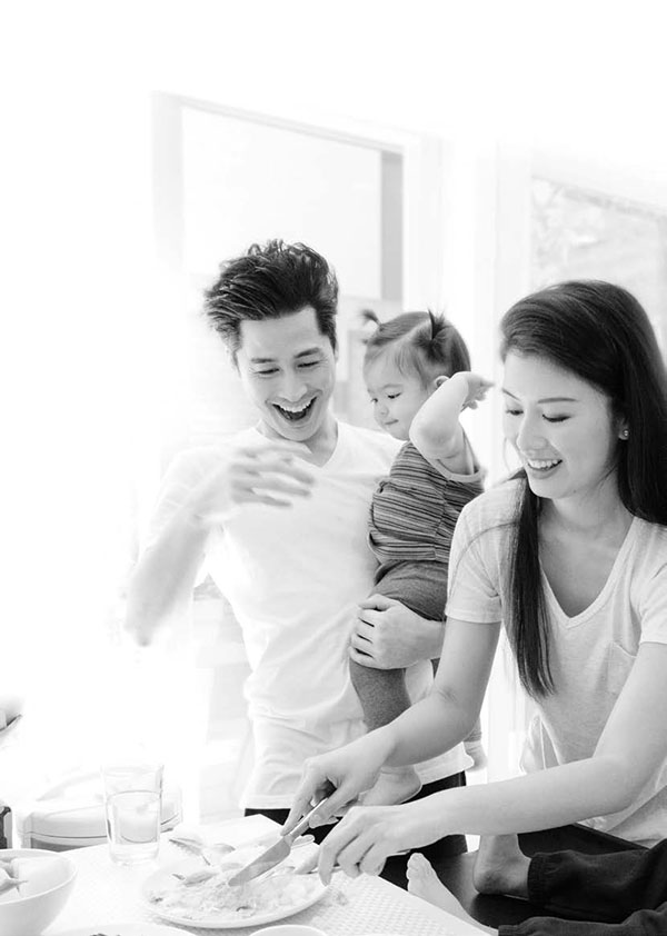 Young family having breakfast in the kitchen